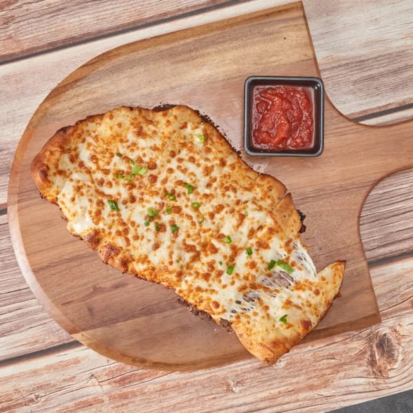 Cheesy garlic bread with melted mozzarella and green herbs, served with a side of marinara sauce.